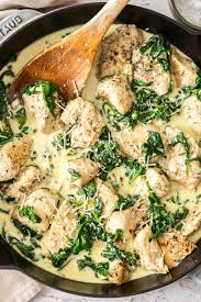 Baked fish fillet with cream callaloo and mash potatoes with carrots, peas and corn