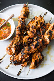 Chicken kababs with yellow rice and veg