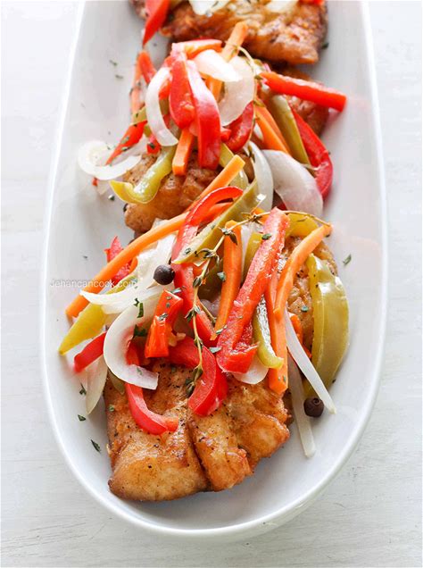 Escovitch fish with baked bammy and spicy pickled vegetables