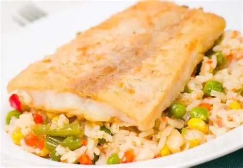 Pumpkin poached white fish fillet with seasoned veg rice